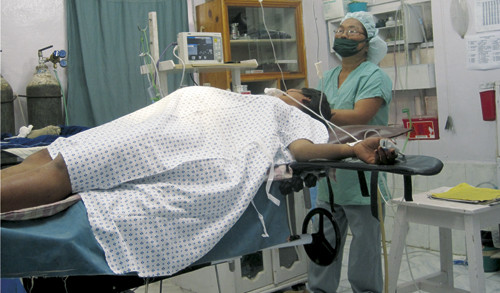 Preparations are made for Caesarean section. After four days in labour, there is a risk of uterine rupture. The patient has…