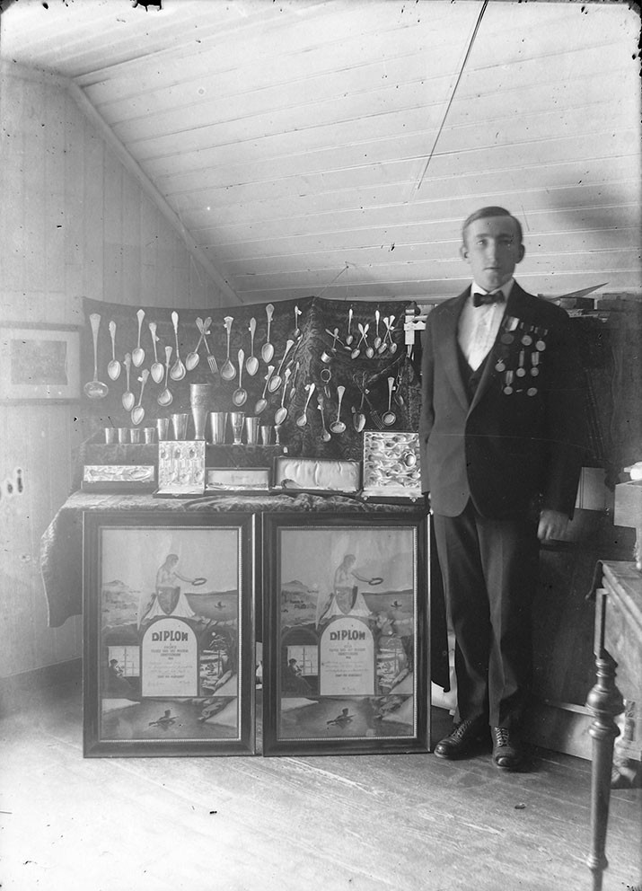Johan Evjen (1887–1971) with his trophy collection, around 1935. Photo: Karl August Berg/Orkla Industrial Museum. In public…